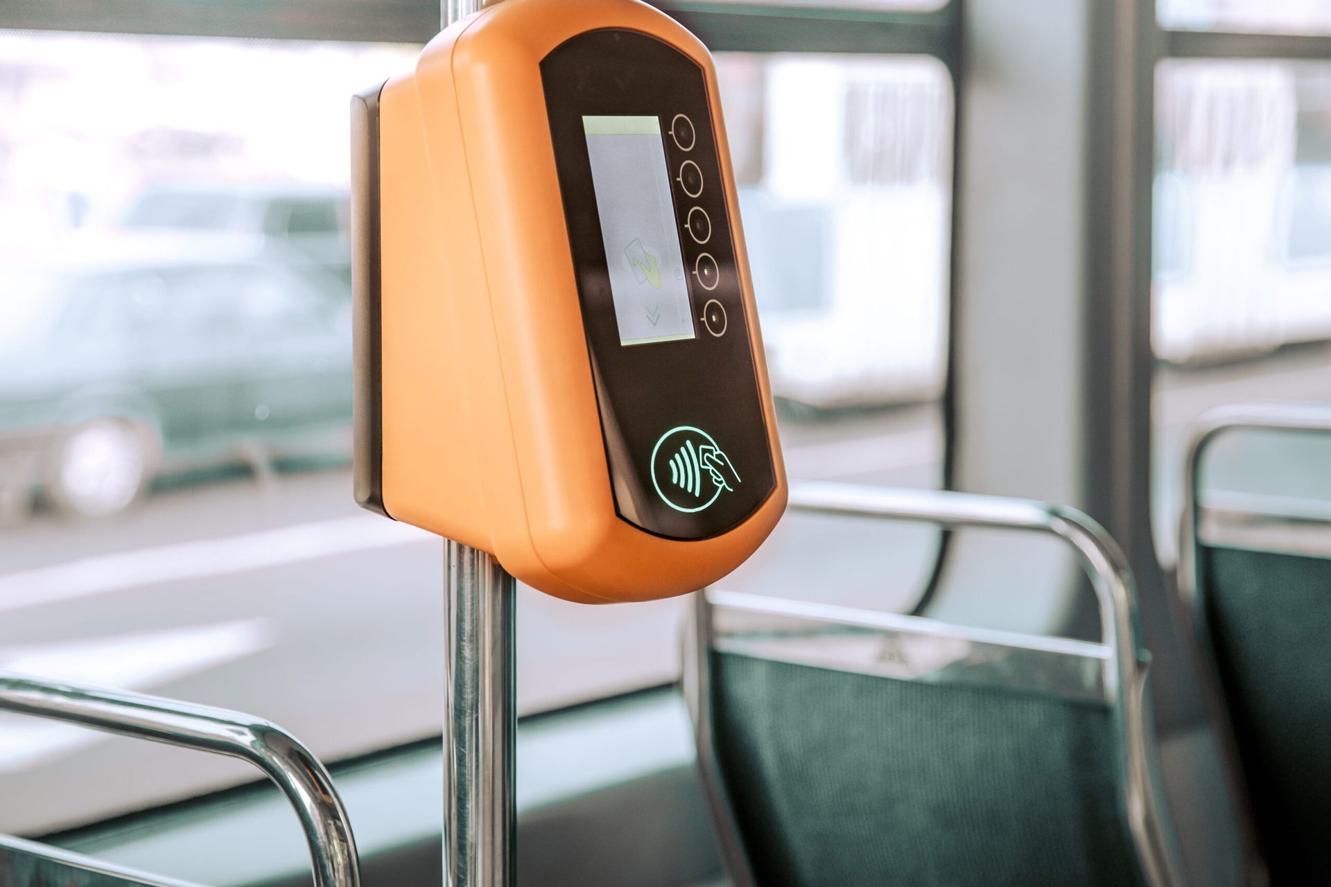 Commuter making a contactless fare payment on public transport